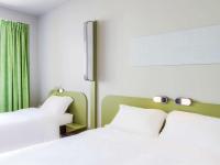 Cama o camas de una habitación en Ibis Budget Braga Centro