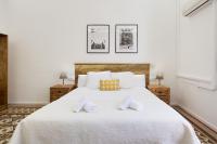 Postel nebo postele na pokoji v ubytování Hostal Girona
