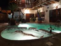 a large pool of water in a building with at The Weekend Hostal in Montañita