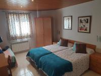 Postel nebo postele na pokoji v ubytování Hostal El Forn