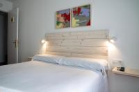 Postel nebo postele na pokoji v ubytování Hotel 3 Arcs