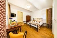 Postel nebo postele na pokoji v ubytování Bellevue Hotel Benešov