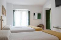 Postel nebo postele na pokoji v ubytování Hotel 3 Arcs