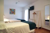 Postel nebo postele na pokoji v ubytování Hotel 3 Arcs