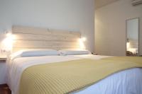 Postel nebo postele na pokoji v ubytování Hotel 3 Arcs