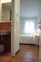 Postel nebo postele na pokoji v ubytování Hotel 3 Arcs