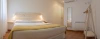 Postel nebo postele na pokoji v ubytování Hotel 3 Arcs