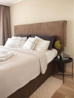 A bed or beds in a room at Central Point by Zoom Apartments