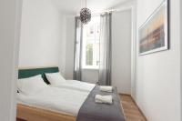 Posteľ alebo postele v izbe v ubytovaní Apartament Mickiewicza