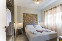 Postel nebo postele na pokoji v ubytování NK Apartments