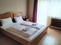 Posteľ alebo postele v izbe v ubytovaní Pension Tilly