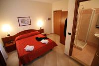 A bed or beds in a room at Hotel Della Volta