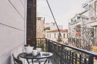 A balcony or terrace at Neoclassical Apartment near Acropolis - LivingStone Crystal