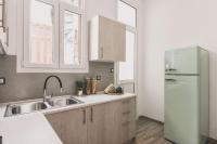 A kitchen or kitchenette at Neoclassical Apartment near Acropolis - LivingStone Crystal