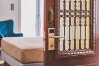 A bed or beds in a room at Neoclassical Apartment near Acropolis - LivingStone Crystal