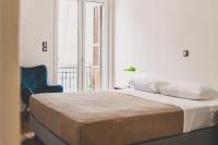 A bed or beds in a room at Neoclassical Apartment near Acropolis - LivingStone Crystal