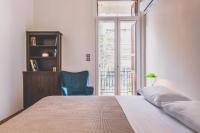 A bed or beds in a room at Neoclassical Apartment near Acropolis - LivingStone Crystal