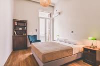 A bed or beds in a room at Neoclassical Apartment near Acropolis - LivingStone Crystal