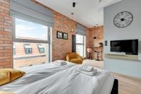 Posteľ alebo postele v izbe v ubytovaní Comfort Apartments Granaria