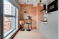 Kuchyňa alebo kuchynka v ubytovaní Comfort Apartments Granaria