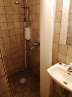 a bathroom with a shower and a sink at Forenom Aparthotel Lahti in Lahti