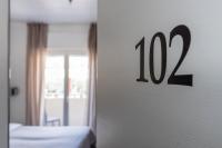 Łóżko lub łóżka w pokoju w obiekcie Hotel Rubino