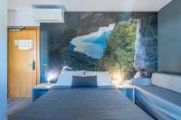 Łóżko lub łóżka w pokoju w obiekcie Hotel Rubino