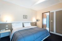 Łóżko lub łóżka w pokoju w obiekcie Hotel Rubino