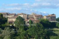 a view of a town with a castle at La Colline Bleue in Banne