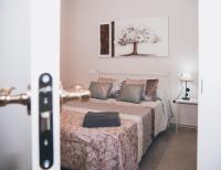 Cama o camas de una habitación en Apartamentos Centro Emérita