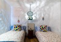 Postel nebo postele na pokoji v ubytování Silence's Cave Rural House