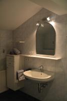 a bathroom with a sink and a mirror at Haus Höring in Dienten am Hochkönig