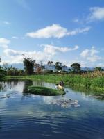 a person in a small boat on a river at Beautiful Yilan Resort in Dongshan