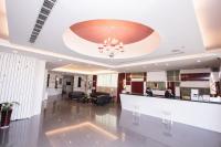 a lobby with a reception desk and a chandelier at Yoyo Hotel in Chiayi City