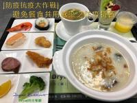 a table with a bowl of soup and plates of food at Dryad Motel in Tainan