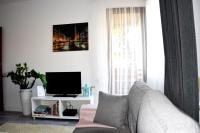 Televízia a/alebo spoločenská miestnosť v ubytovaní Apartament 1 Gdansk Bisko Plazy
