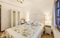 Postel nebo postele na pokoji v ubytování InmoBooking Family House Holidays