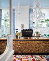 a dining room with chandeliers and a table at Graduate by Hilton Nashville in Nashville