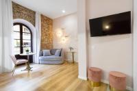 Televízia a/alebo spoločenská miestnosť v ubytovaní Apartamentos Casapalma Centro Histórico
