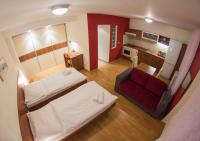 Posteľ alebo postele v izbe v ubytovaní Urpí­n City Residence