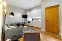 Televízia a/alebo spoločenská miestnosť v ubytovaní Apartamentos Casapalma Centro Histórico