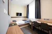 Televízia a/alebo spoločenská miestnosť v ubytovaní Apartments Danube