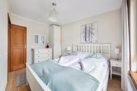 Posteľ alebo postele v izbe v ubytovaní Apartamenty Sun & Snow Rezydencja Park