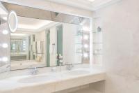 a bathroom with a sink and a large mirror at Le Bristol Paris - an Oetker Collection Hotel in Paris