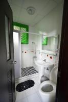 a bathroom with a toilet and a sink and a shower at Guanshan Fukuda Homestay in Guanshan