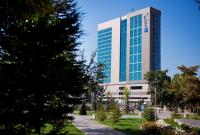a tall building with a tree in front of it at Radisson Blu Hotel, Kayseri in Kayseri