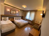 Postel nebo postele na pokoji v ubytování Anzac Hotel
