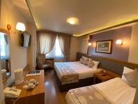 Postel nebo postele na pokoji v ubytování Anzac Hotel