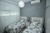 A bed or beds in a room at PASEO MARITIMO Los Boliches. Fuengirola