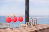 a row of four wine glasses sitting on a table at Les Bords De Mer in Marseille